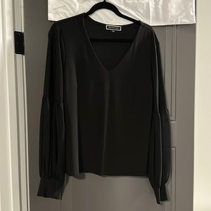 Black blouse with sheer sleeves